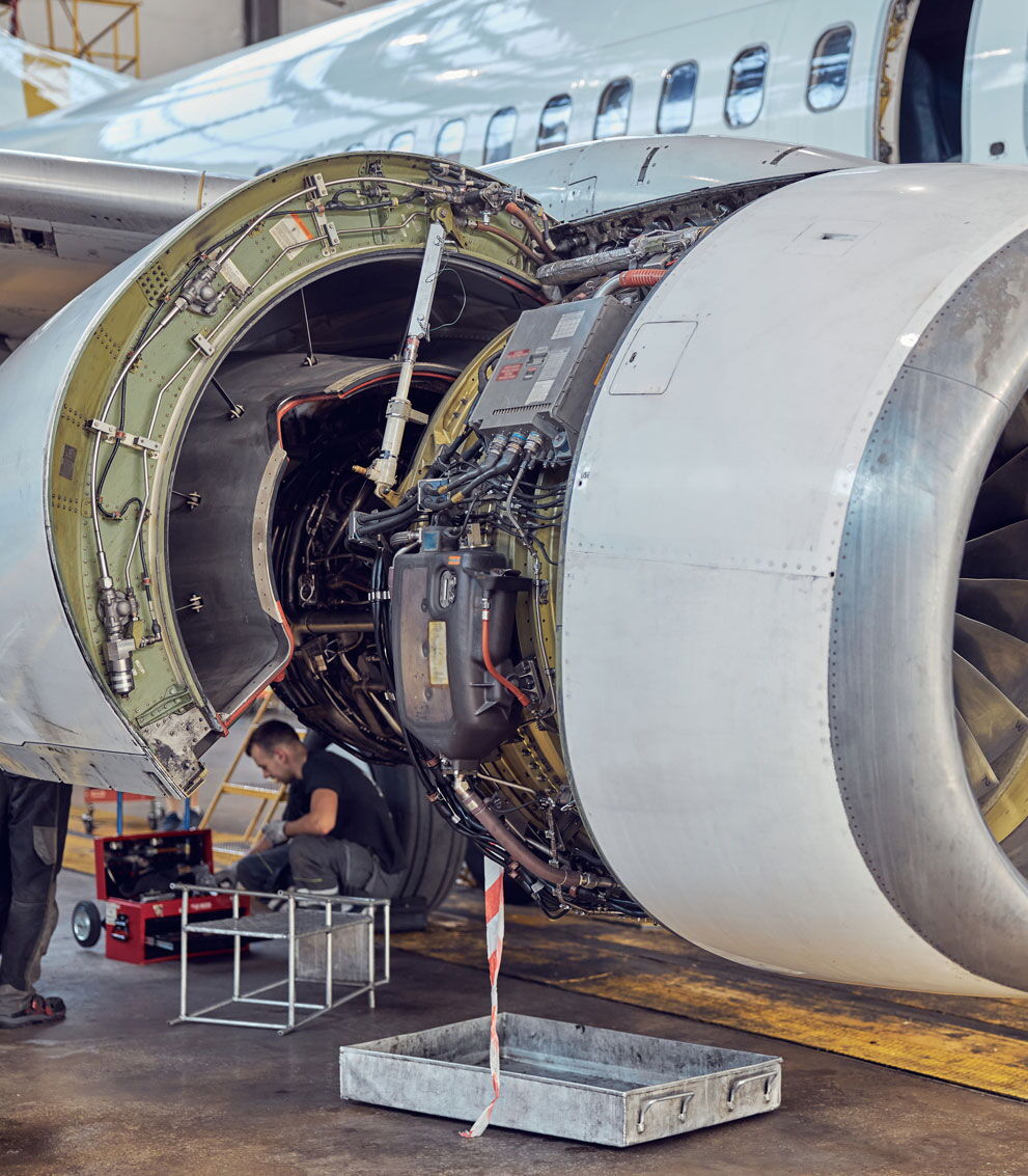 Crew working on a jet engine.